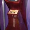 Image of a red Computer Space cabinet, a coin-op video game by Syzygy/Nutting Associates 1971 A sparkling red Computer Space cabinet