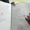 Toru Iwatani showing off his original design drawings of arcade video game Pac-Man, 2010 Pac-Man