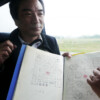 Creator Toru Iwatani shows off his original design drawings of arcade video game Pac-Man, 2010 Pac-Man